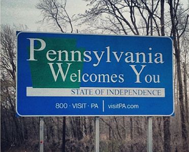 Highway sign welcoming motorists to Pennsylvania: State of Independence.